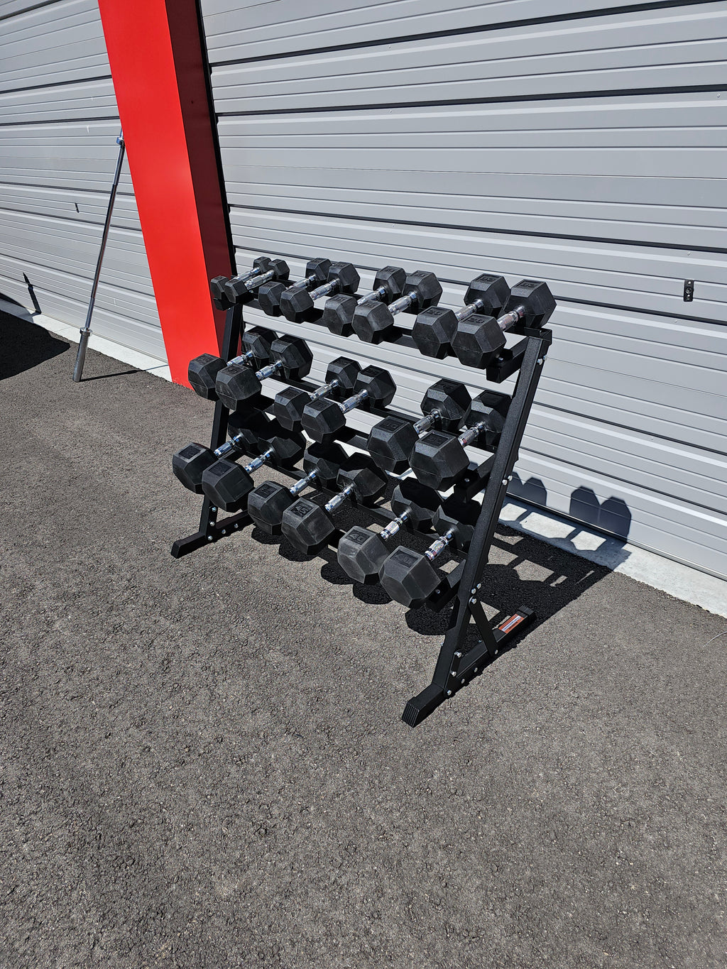 5-50lb dumbbells in 5lb increments with storage rack