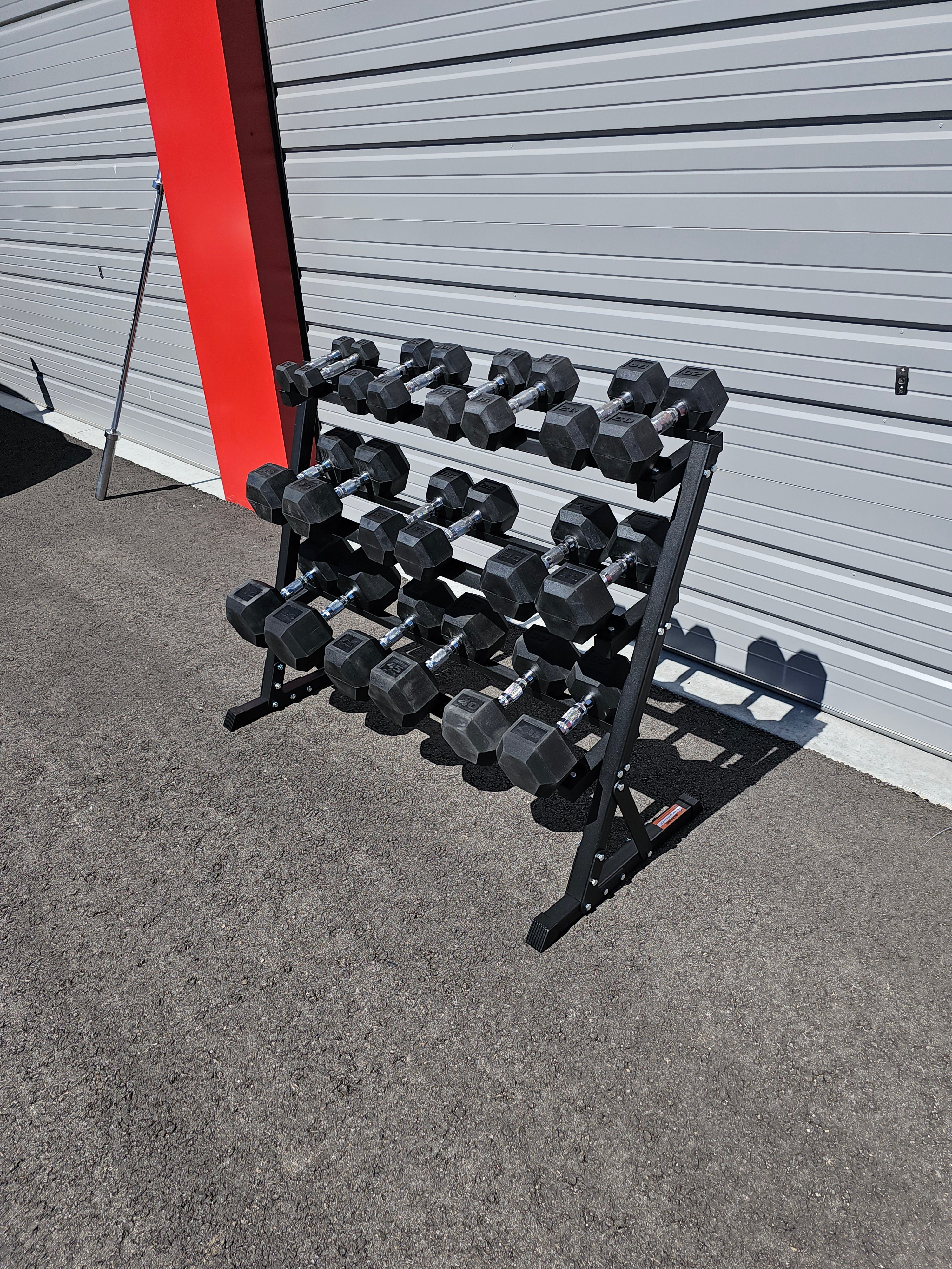 5-50lb dumbbells in 5lb increments with storage rack