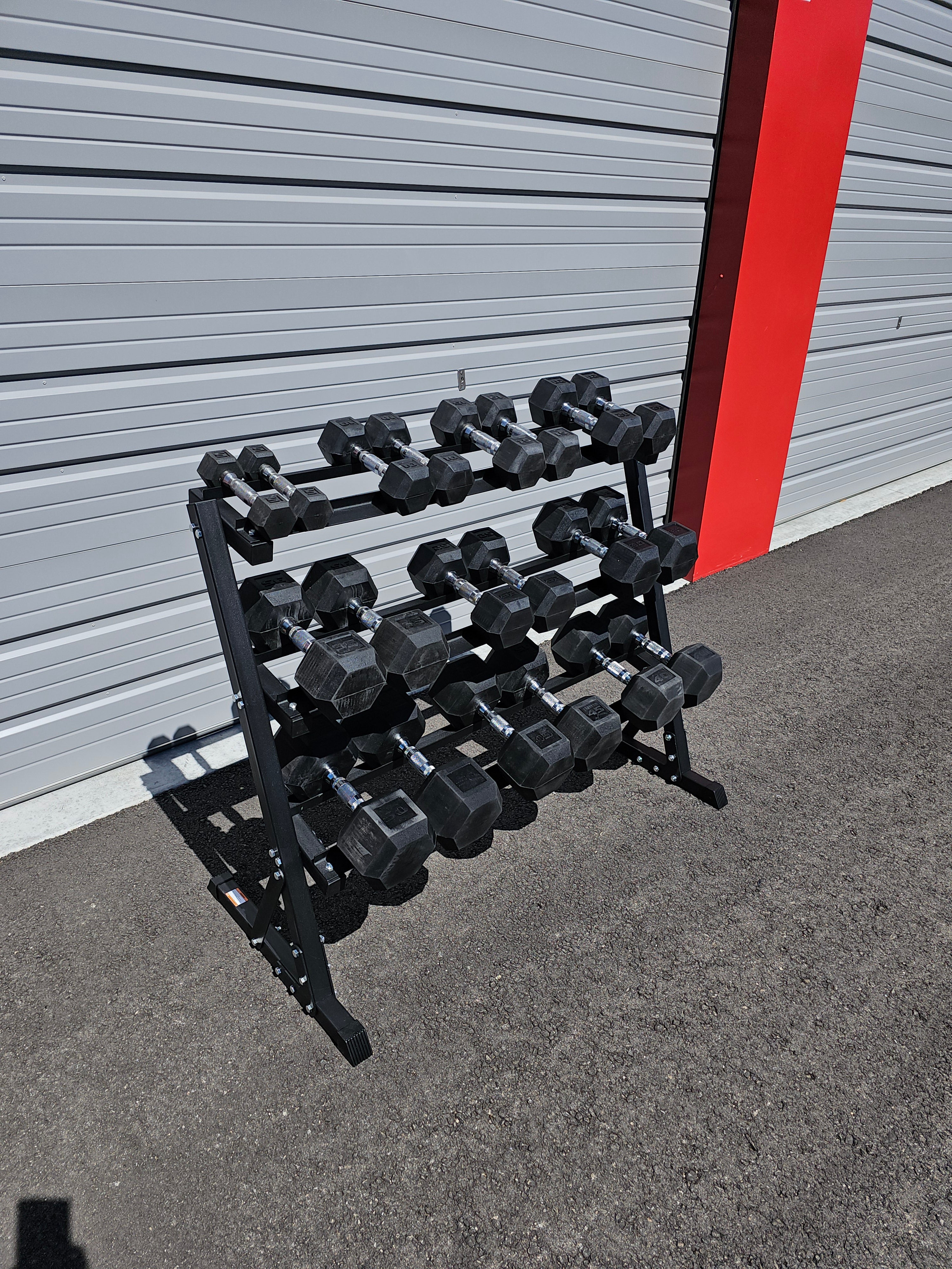 5-50lb dumbbells in 5lb increments with storage rack