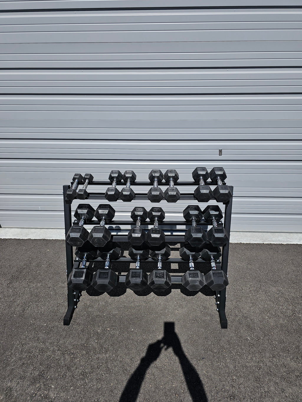 5-50lb dumbbells in 5lb increments with storage rack