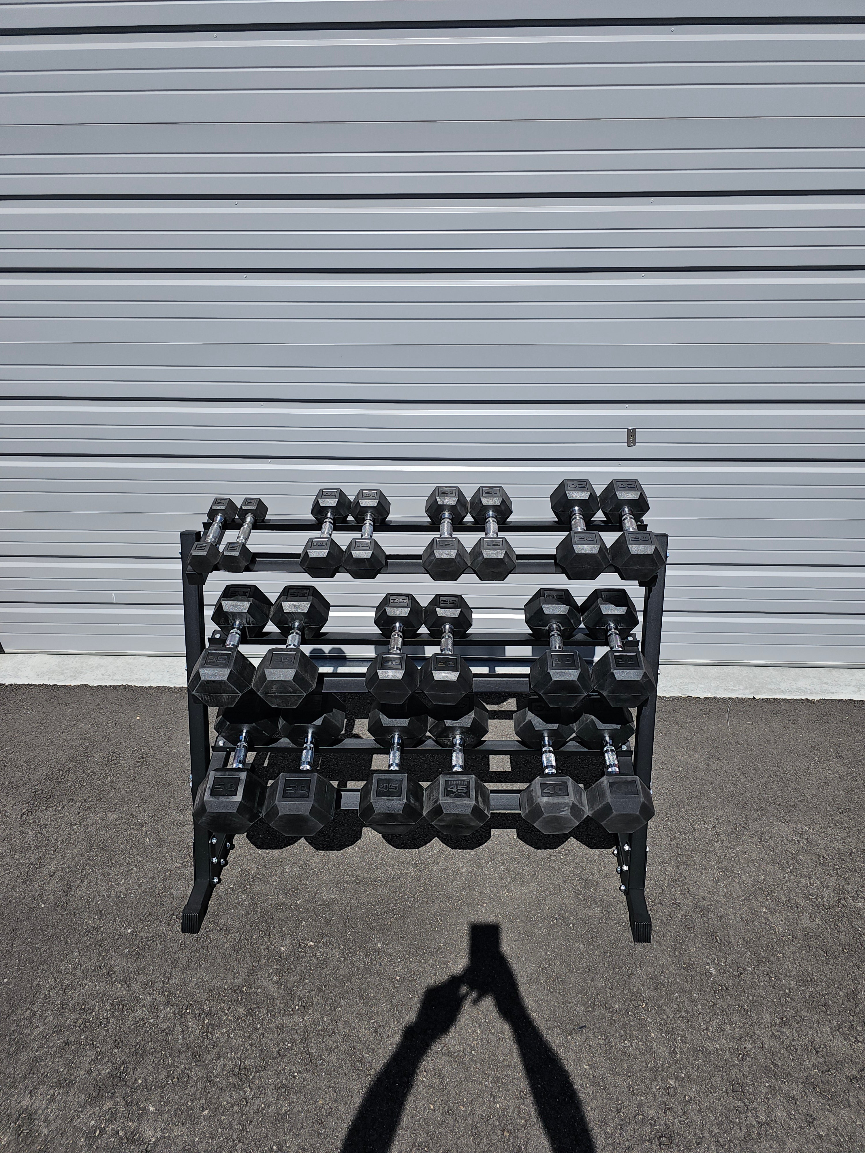 5-50lb dumbbells in 5lb increments with storage rack